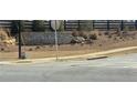 Stone sign for Highland Park community with landscaping at 6014 Spring Way, Stonecrest, GA 30038