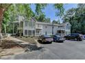 Traditional condo building featuring a well-manicured lawn and convenient parking at 102 Gettysburg Pl, Sandy Springs, GA 30350