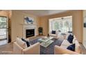 Bright, staged living room featuring a fireplace, bay window and new furniture at 102 Gettysburg Pl, Sandy Springs, GA 30350