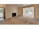 Living room features a fireplace and large windows at 102 Gettysburg Pl, Sandy Springs, GA 30350