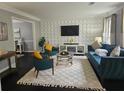 Living room featuring a teal sofa and geometric wall decor at 4503 Balmoral Nw Rd, Kennesaw, GA 30144