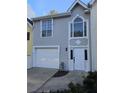 This home has a bright garage door and a stucco façade with a large front door at 1041 Kennesborough Nw Rd, Kennesaw, GA 30144