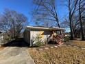 Side view of a renovated house, showcasing its exterior features at 781 Peyton Nw Ave, Atlanta, GA 30318