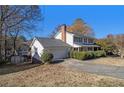 White two-story house with a large backyard and attached garage at 201 Vistawood Ln, Marietta, GA 30066