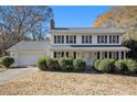 Two-story house with white siding, gray roof, and landscaping at 201 Vistawood Ln, Marietta, GA 30066