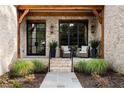 Inviting front porch with brick detailing and comfortable seating at 1095 Curry Dr, Atlanta, GA 30319