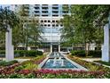 Beautiful building entrance with landscaping and water feature at 3324 Peachtree Ne Rd # 2718, Atlanta, GA 30326