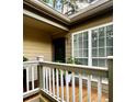 Front entrance showcasing green door, sidelight window, with house number 609 and porch at 609 Mill Pond Se Dr, Smyrna, GA 30082