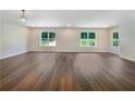 Bright open living area featuring hardwood floors and large windows offering plenty of natural light at 89 Elsberry Rd, Dallas, GA 30157