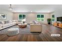 Bright living room with hardwood floors, large windows, and modern furniture at 89 Elsberry Rd, Dallas, GA 30157