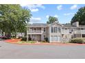 Charming condo building with lush landscaping, inviting curb appeal and ample parking at 707 Augusta Se Dr, Marietta, GA 30067