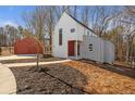 Modern farmhouse design with attached garage and spacious yard at 145 Cedarwood Ln, Roswell, GA 30075