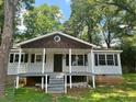 Cozy one-story home with a welcoming front porch, perfect for relaxing outdoors at 115 Montgomery St, Atlanta, GA 30317