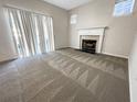 A bright living area with a fireplace and sliding glass doors at 4337 Ben Hill Rd, Atlanta, GA 30349