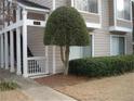 Condo building entrance with landscaping and walkway at 17 Fair Haven Se Way, Smyrna, GA 30080