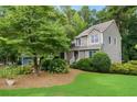 A home's well-manicured lawn and lush landscaping complement its attractive exterior at 978 W Mill Bnd, Kennesaw, GA 30152