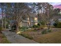 Beautiful home with meticulously landscaped front yard and mature trees, showcasing its curb appeal at 978 W Mill Bnd, Kennesaw, GA 30152