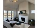 Inviting living room with a fireplace, plenty of seating, and a neutral color palette at 507 Godfrey Dr, Cumming, GA 30040