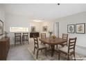 Elegant dining room features a wood table with six chairs and access to kitchen at 300 Johnson Ferry Ne Rd # A203, Sandy Springs, GA 30328