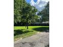 Brick house with covered porch and spacious yard at 5595 Stagecoach Rd, Rex, GA 30273