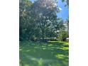 Ranch house nestled among lush trees and green lawn at 5595 Stagecoach Rd, Rex, GA 30273