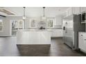 Modern kitchen with white cabinets, granite counters, and island at 279 Lewis Way, Canton, GA 30115