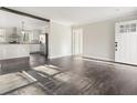 Open concept living room and kitchen with hardwood floors at 279 Lewis Way, Canton, GA 30115