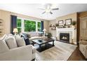 Cozy living room featuring a fireplace and large windows at 138 Stargaze Rdg, Canton, GA 30114