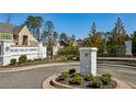 Stone entrance to River Valley Reserve community with manicured landscaping and a welcoming gate at 235 River Valley Court Lot 4 Ct, Atlanta, GA 30328