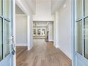 Bright, open entryway with hardwood floors leading into a spacious living area at 216 Ewing Way, Dacula, GA 30019
