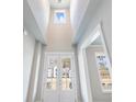 Bright foyer featuring high ceilings and transom windows for natural light at 216 Ewing Way, Dacula, GA 30019