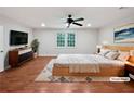 Spacious main bedroom with a ceiling fan and soft natural light creating a relaxing atmosphere at 2122 Belhaven Se Ln, Atlanta, GA 30315