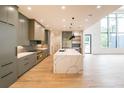 Modern kitchen with sleek gray cabinetry, marble countertops, and high-end appliances at 820 Moores Mill Nw Rd, Atlanta, GA 30327