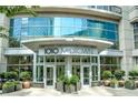 Modern building entrance of 1010 Midtown with landscaping at 1080 Peachtree Ne St # 1309, Atlanta, GA 30309