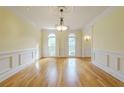 A spacious dining room with hardwood floors and detailed trim at 1357 Baniff Ct, Snellville, GA 30078