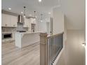 Open concept kitchen with white cabinets and gray island at 1996 Deco Dr, Kennesaw, GA 30144
