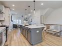 Modern kitchen with a large island and stainless steel appliances at 1996 Deco Dr, Kennesaw, GA 30144