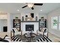 Cozy living room featuring a fireplace, modern decor, and comfortable seating for a welcoming atmosphere at 1988 Deco Dr, Kennesaw, GA 30144