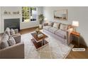 Cozy living room featuring a fireplace, plush seating, and bright natural light at 201 Gallant Se Ln # 25, Mableton, GA 30126