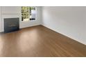 Bright living room featuring a fireplace and light hardwood floors at 201 Gallant Se Ln # 25, Mableton, GA 30126