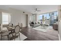 Bright living area with a dining space, hard wood floors, and amazing views of the surrounding skyscrapers at 3325 Piedmont Ne Rd # 1801, Atlanta, GA 30305