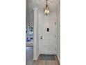 Front entry with classic paneled door and light fixture at 882 Cedar Canyon Se Sq, Marietta, GA 30067