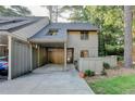 Exterior of a gray home with a covered carport and mature trees at 882 Cedar Canyon Se Sq, Marietta, GA 30067