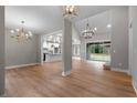 Open concept dining area with hardwood floors and chandelier at 136 Rainey Rd, Temple, GA 30179