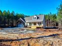 Newly constructed home nestled in a wooded setting at 136 Rainey Rd, Temple, GA 30179