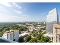 Expansive city view showcasing lush greenery, surrounding buildings, and a clear blue sky at 3324 Peachtree Ne Rd # 2706, Atlanta, GA 30326