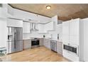 Sleek kitchen with stainless steel appliances, modern cabinetry, and hardwood floors for a contemporary feel at 3324 Peachtree Ne Rd # 2706, Atlanta, GA 30326