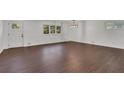 Spacious living room featuring hardwood floors and a modern chandelier at 4340 W Linda Dr, Douglasville, GA 30134