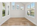 Light-filled office space featuring hardwood floors and large windows at 495 Pearl St, Cumming, GA 30040