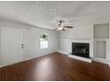 Bright living room with hardwood floors and a fireplace, perfect for gatherings at 3384 Brookside Ln, Jonesboro, GA 30236
